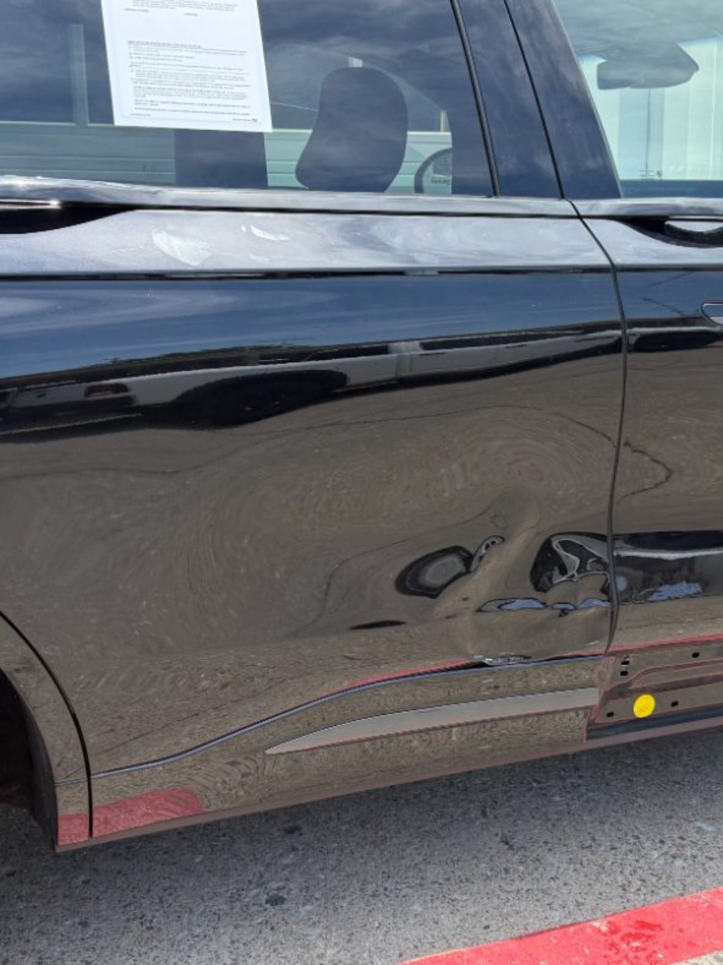 Lincoln Nautilus with a crushed driver door and rocker panel before collision repair in Plano TX