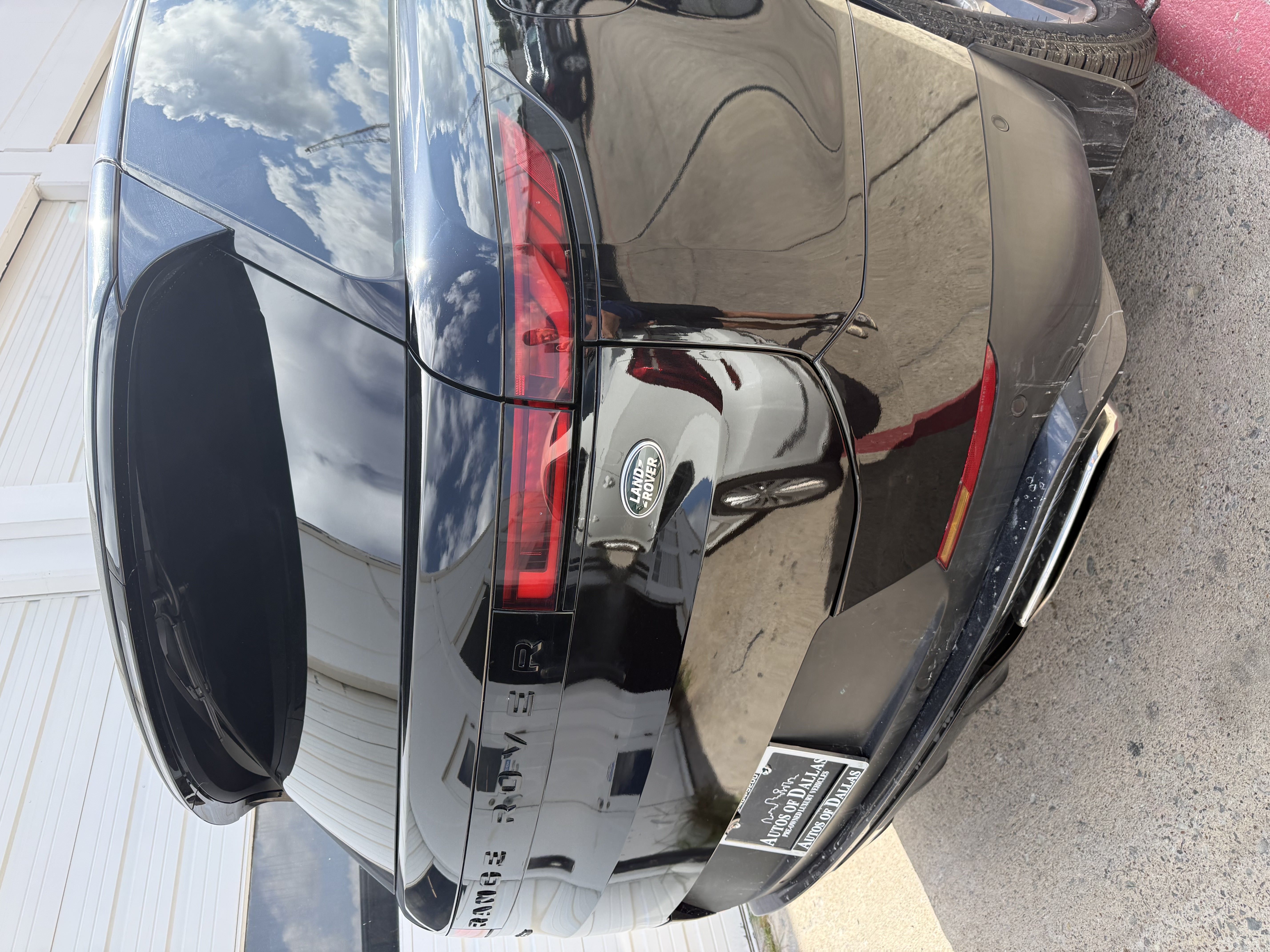 Range Rover rear quarter refinished, clean gloss black